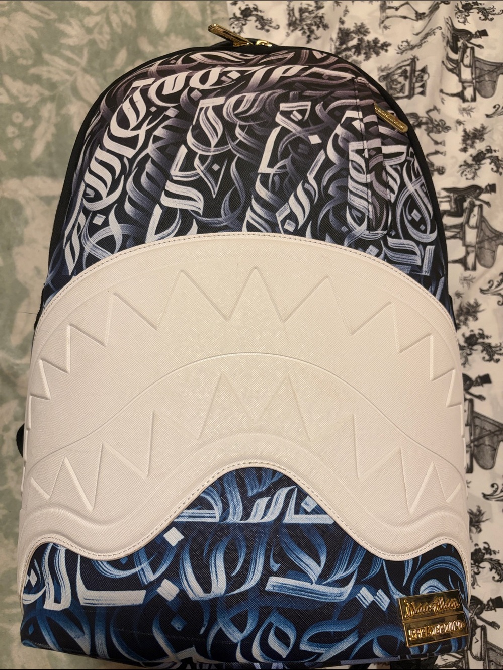 Sprayground White and Blue Shark Tooth Pattern Backpack
